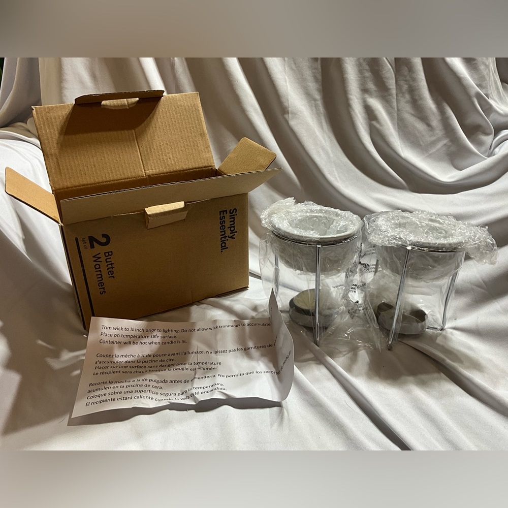 New in Box Simply Essential Butter Warmers Tea Light included as well as Papers